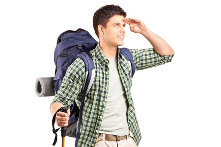 A hiker with backpack looking isolated on white backgroundの写真素材