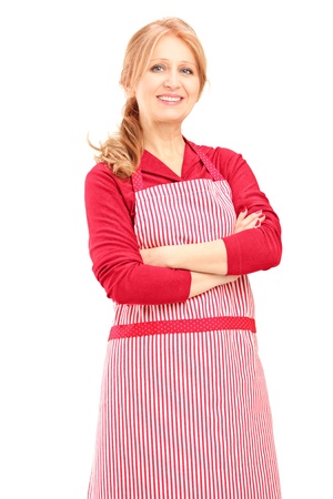 Smiling female worker wearing an apron and posing isolated on white backgroundの写真素材