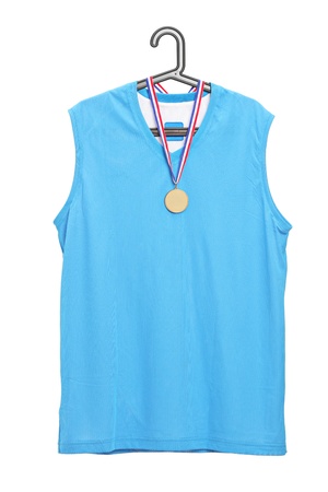 Sport jersey and a golden medal hanging on a hanger isolated on white backgroundの写真素材