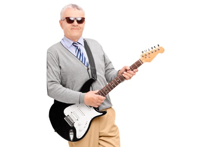Mature man with guitar leaning against wall, isolated on white backgroundの写真素材