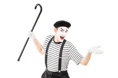 Mime artist holding a cane and gesturing isolated on white backgroundの写真素材
