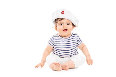 Cute baby girl with sailor hat isolated on white backgroundの写真素材