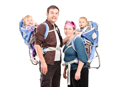 Parents posing with their babies isolated on white backgroundの写真素材