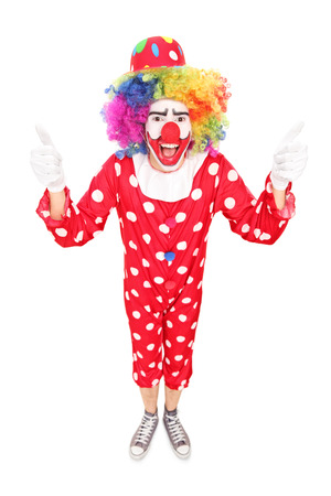 Excited clown giving thumbs up isolated on white backgroundの写真素材