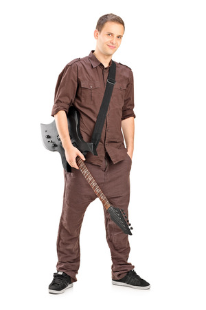 Full length portrait of a young male guitar player isolated on white backgroundの写真素材