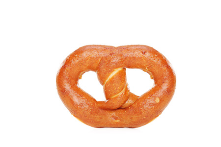 Studio shot of a freshly baked pretzel isolated on white background