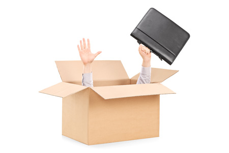 Man stretching his hands out of a box isolated on white background 