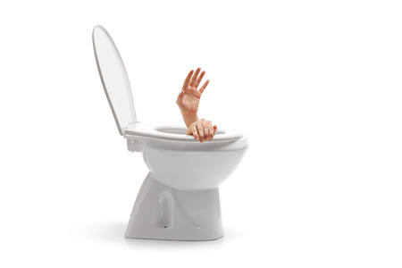 Hands arising from a toilet bowl isolated on white backgroundの写真素材