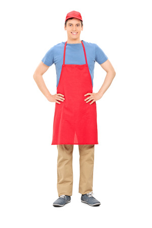 Full length portrait of a male vendor posing isolated on white backgroundの写真素材