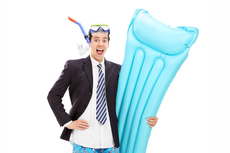 Joyful businessman with diving equipment posing isolated on white backgroundの写真素材