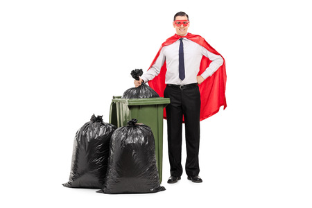 Superhero standing by a trash can isolated on white backgroundの写真素材