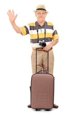 Mature tourist waving with his hand isolated on white backgroundの写真素材