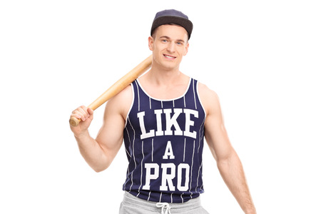 Handsome young man holding a baseball bat and looking at the camera isolated on white background