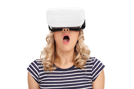 Surprised woman wearing virtual reality googles isolated on white background