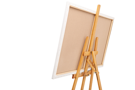 Rear view studio shot of a wooden easel with a canvas on it isolated on white backgroundの写真素材
