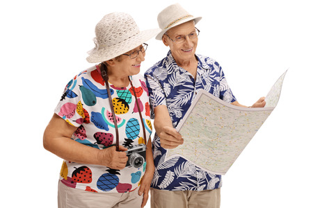 Elderly tourists looking at a generic map isolated on white backgroundの写真素材