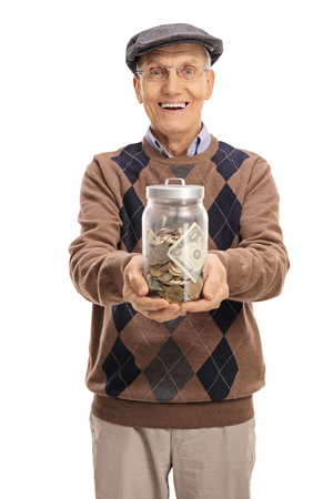 Cheerful senior with a jar filled with money isolated on white backgroundの写真素材