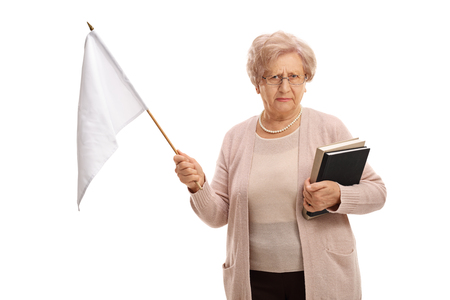 Sad senior with a white flag looking at the camera isolated on white backgroundの写真素材
