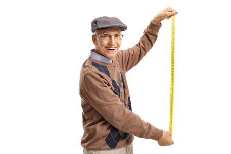 Senior holding a measuring tape isolated on white backgroundの写真素材