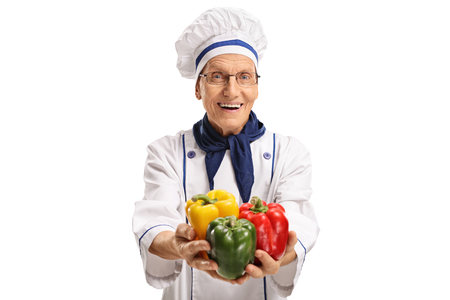 Chef offering peppers isolated on white backgroundの写真素材