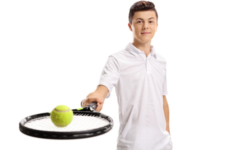 Teen tennis player with a racket and a tennis ball isolated on white backgroundの写真素材
