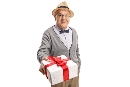 Mature man giving a present isolated on white backgroundの写真素材