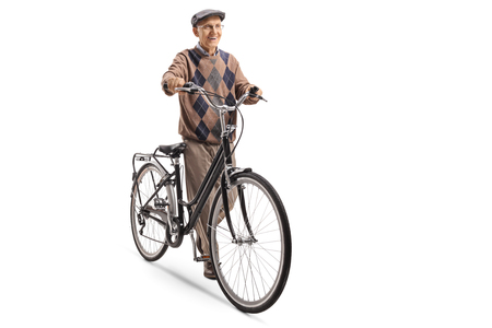 Full length portrait of a senior pushing a bicycle isolated on white backgroundの写真素材