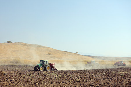 Sveti Nikole, Macedonia October 17, 2018: Tractors working on a soil field near Sveti Nikole, Macedonia.のeditorial素材