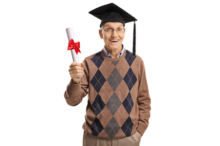 Excited senior man with a graduation hat and diploma isolated on whiteの写真素材