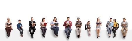 Old and young people sitting on a banner reading books isolated on white