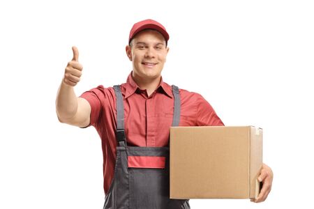 Man mover holding a package and making a thumb up sign isolated on white background