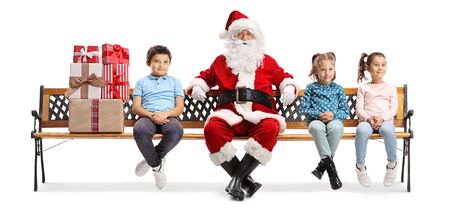 Santa Claus sitting on a bench with a pile of presents and children isolated on white backgroundの写真素材