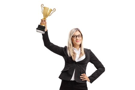 Businesswoman with a golden trophy cup isolated on white backgroundの写真素材