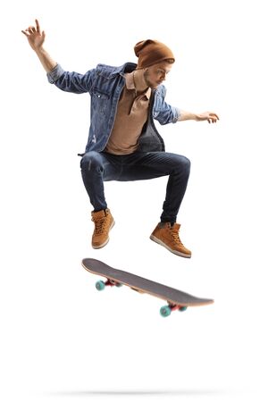 Young man jumping high with a skateboard isolated on white backgroundの写真素材