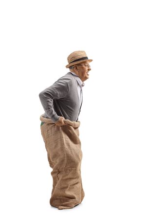Elderly man inside a sack ready to jump isolated on white backgroundの写真素材