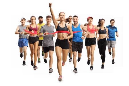 Full length portrait shot of people running a marathon race and a young woman finishing first isolated on white background