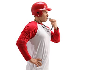 Profile shot of a baseball coach using a whistle isolated on white background