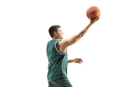 Basketball player laying a ball isolated on white backgroundの写真素材