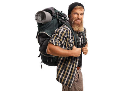 Cheerful hiker with a backpack smiling isolated on white backgroundの写真素材