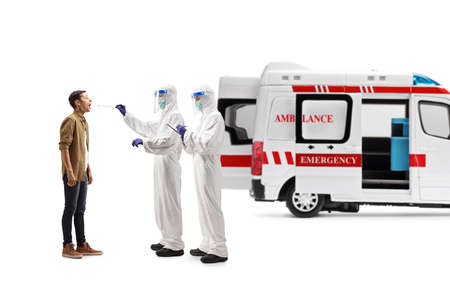 Ambulance vehicle and doctors in a hazmat suits testing a man for covid-19 virus isolated on white...