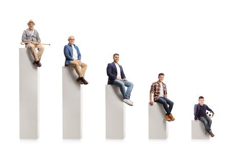 Child, young and elderly men sitting on a graph chart isolated on white backgroundの写真素材