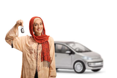 Young muslim woman holding a car key and smilingの写真素材