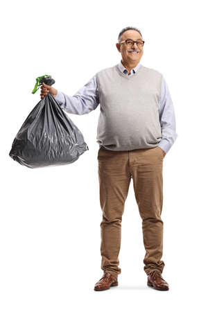 Full length portrait of a mature man holding a lack bin bag isolated on white backgroundの写真素材