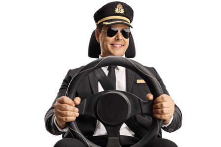 Young chauffeur driving a car with sunglasses isolated on white backgroundの写真素材