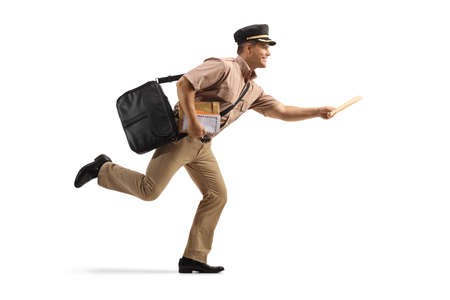 Full length profile shot of a mailman running and carrying letters isolated on white backgroundの写真素材