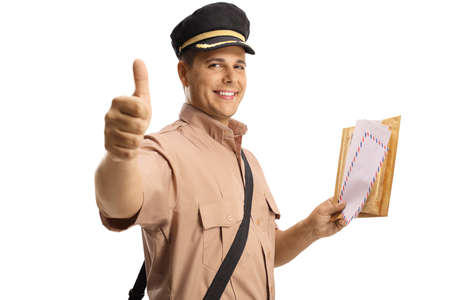 Smiling mailman holding a letter and gesturing a thumb up sign isolated on white background