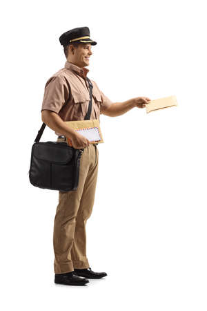 Full length profile shot of a mailman delivering a letter isolated on white backgroundの写真素材