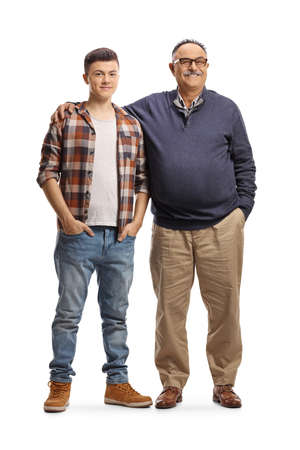 Full length portrait of a father embracing son isolated on white backgroundの写真素材