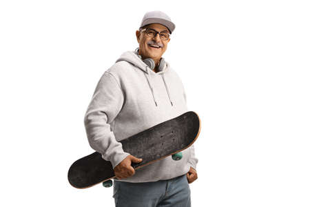 Cheerful mature man with a cap and hoodie holding a skateboard isolated on white backgroundの写真素材