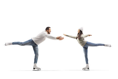 Casual young man and woman practicing ice skating isolated on white background